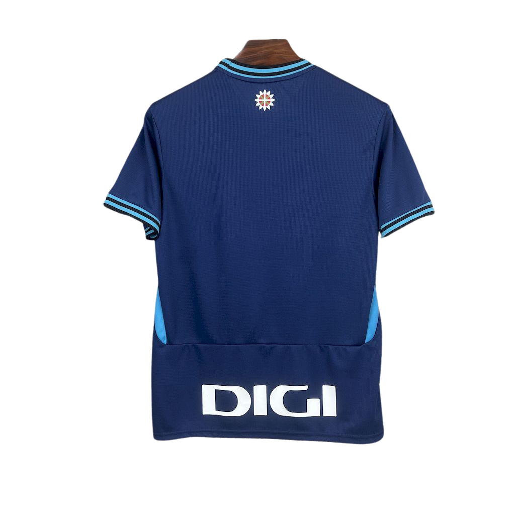 camisa-atlhetic-bilbao-il-2025-26-torcedor-masculina-camiseta-champions-league-lancamento-europeu-segunda-away-oficial-kutxabank-castore-azul-escuro-azul-claro-gola-azul-manga-azul