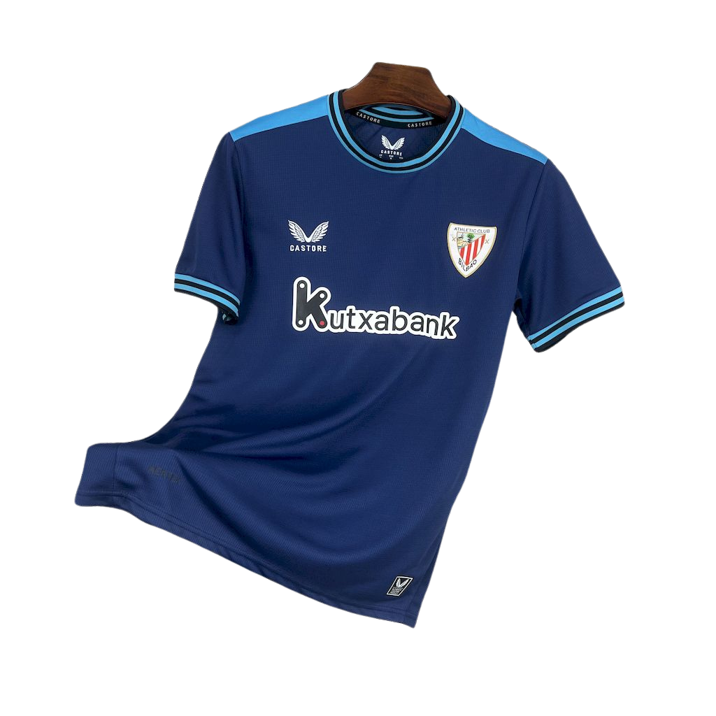 camisa-atlhetic-bilbao-il-2025-26-torcedor-masculina-camiseta-champions-league-lancamento-europeu-segunda-away-oficial-kutxabank-castore-azul-escuro-azul-claro-gola-azul-manga-azul